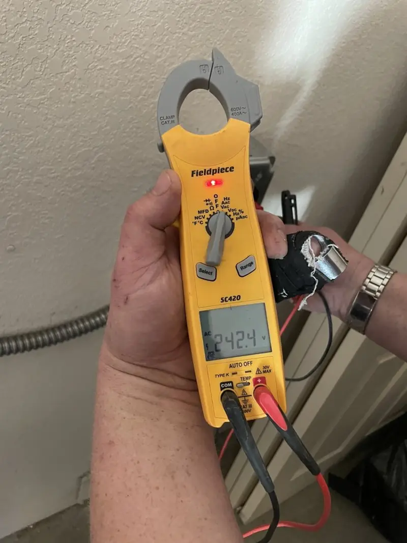 Voltage testing with clamp meter during Electrical Installation Services in Attleboro